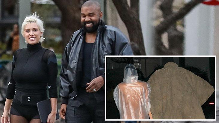 Ünlü çiftin tarzı olay oldu! Şeffaf yağmurlukla sokakta dolaştı