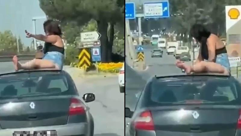 Hareket halindeki otomobilin üzerine çıktı: Sürücü ve yolcu gözaltına alındı